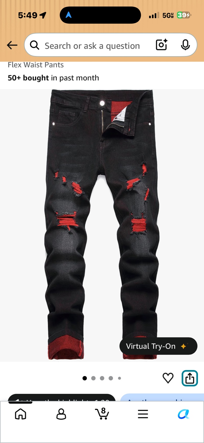 Black distressed jeans with red details beneath the rips and red cuffs