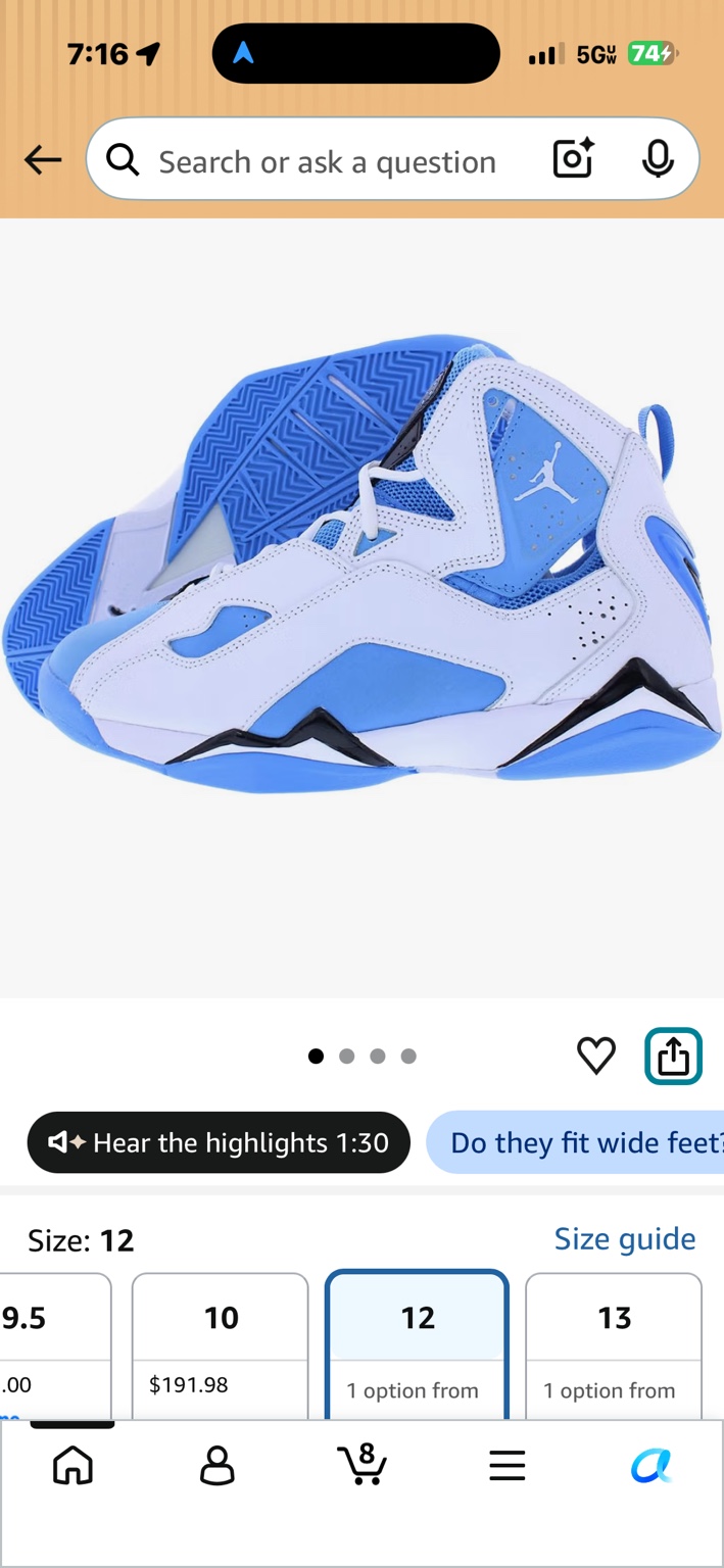 Pair of white and bright blue Jordan sneakers with Jumpman logo, black midsole accents, and blue outsole